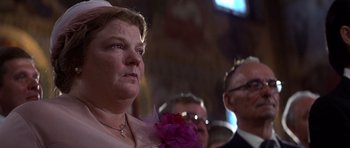 Movie still from “The Deer Hunter” (1978), directed by Michael Cimino – A person wearing a pink dress; Close Up shot, Low angle