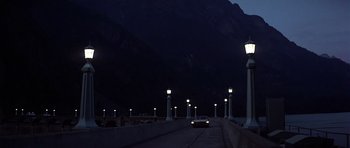 Movie still from “The Deer Hunter” (1978), directed by Michael Cimino – A car driving down a street at night; Extreme Wide shot, Low angle