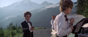 Movie still from “The Deer Hunter” (1978), directed by Michael Cimino – A group of people standing on top of a hill; Medium shot, Low angle