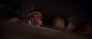 Movie still from “The Deer Hunter” (1978), directed by Michael Cimino – A man with a bandage on his face and another man with a bandage on his head; Close Up shot, Low angle