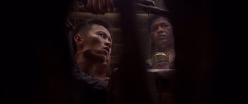 Movie still from “The Deer Hunter” (1978), directed by Michael Cimino – Two men sitting next to each other on a bus; Close Up shot, Over the shoulder angle