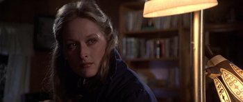 Movie still from “The Deer Hunter” (1978), directed by Michael Cimino – A person wearing a jacket in a room; Close Up shot, Over the shoulder angle