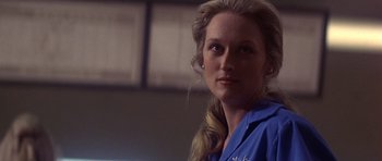 Movie still from “The Deer Hunter” (1978), directed by Michael Cimino – A person wearing a blue shirt; Close Up shot, Low angle