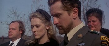 Movie still from “The Deer Hunter” (1978), directed by Michael Cimino – A man and a woman standing next to each other; Close Up shot, Low angle