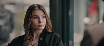 Movie still from “10 Days of a Bad Man” (2023), directed by Uluç Bayraktar – A beautiful young lady looking off into the distance; Close Up shot, Low angle