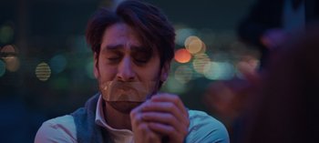Movie still from “10 Days of a Bad Man” (2023), directed by Uluç Bayraktar – A man with duct tape over his mouth; Close Up shot, Low angle