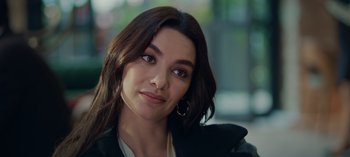 Movie still from “10 Days of a Bad Man” (2023), directed by Uluç Bayraktar – A person with long hair; Close Up shot, Over the shoulder angle