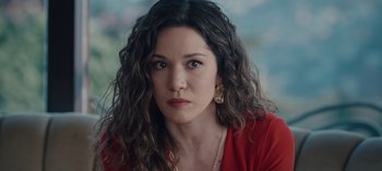 Movie still from “10 Days of a Bad Man” (2023), directed by Uluç Bayraktar – A person wearing a red shirt; Close Up shot, High angle