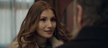 Movie still from “10 Days of a Bad Man” (2023), directed by Uluç Bayraktar – A beautiful young lady sitting in front of a mirror; Close Up shot, Over the shoulder angle