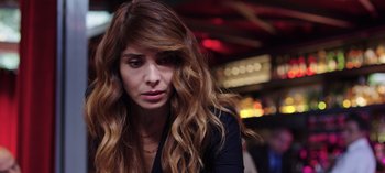 Movie still from “10 Days of a Good Man” (2023), directed by Uluç Bayraktar – A person with long brown hair; Close Up shot, High angle