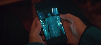Movie still from “10 Days of a Good Man” (2023), directed by Uluç Bayraktar – A person holding a cell phone in their hands; Extreme Close Up shot, High angle