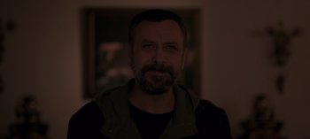 Movie still from “10 Days of a Good Man” (2023), directed by Uluç Bayraktar – A person with a beard; Close Up shot, Low angle