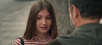 Movie still from “10 Days of a Good Man” (2023), directed by Uluç Bayraktar – A young woman is talking to an older man; Close Up shot, Over the shoulder angle