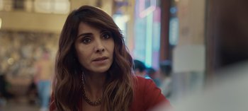 Movie still from “10 Days of a Good Man” (2023), directed by Uluç Bayraktar – A person wearing a red shirt; Close Up shot, Over the shoulder angle