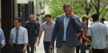Movie still from “13: The Musical” (2022), directed by Tamra Davis – A group of people walking down a sidewalk; Medium shot, Over the shoulder angle