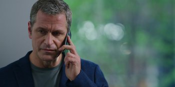 Movie still from “13: The Musical” (2022), directed by Tamra Davis – A person talking on a cell phone; Close Up shot, Low angle