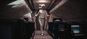 Movie still from “2001: A Space Odyssey” (1968), directed by Stanley Kubrick – A woman walking down the aisle of an airplane; Wide shot, Low angle
