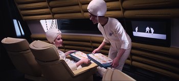 Movie still from “2001: A Space Odyssey” (1968), directed by Stanley Kubrick – A man and a woman in a room; Medium shot, High angle