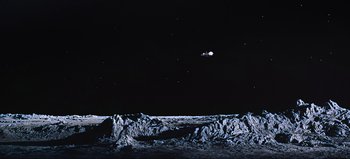 Movie still from “2001: A Space Odyssey” (1968), directed by Stanley Kubrick – An image of an image of the moon in the night sky; Extreme Wide shot, High angle