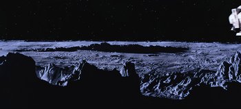 Movie still from “2001: A Space Odyssey” (1968), directed by Stanley Kubrick – A view of the moon at night from a hill; Extreme Wide shot, Overhead angle
