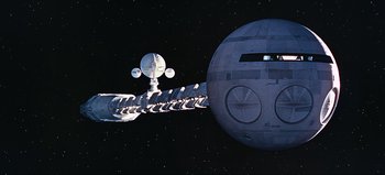 Movie still from “2001: A Space Odyssey” (1968), directed by Stanley Kubrick – An image of a space ship in the night sky; Extreme Wide shot, Overhead angle