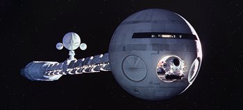Movie still from “2001: A Space Odyssey” (1968), directed by Stanley Kubrick – An image of a space ship in the night sky; Extreme Wide shot, Overhead angle