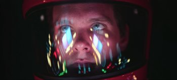 Movie still from “2001: A Space Odyssey” (1968), directed by Stanley Kubrick – A man's face in a television screen; Close Up shot, Low angle