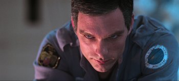 Movie still from “2001: A Space Odyssey” (1968), directed by Stanley Kubrick – A person with a police uniform on; Close Up shot, Low angle