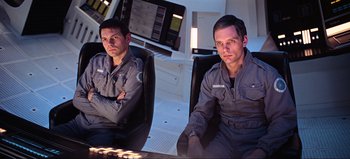Movie still from “2001: A Space Odyssey” (1968), directed by Stanley Kubrick – Two men sitting next to each other in a room; Medium shot, Low angle