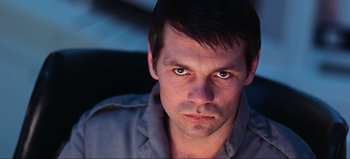 Movie still from “2001: A Space Odyssey” (1968), directed by Stanley Kubrick – A person looking at the camera; Close Up shot, Low angle