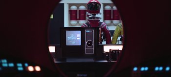 Movie still from “2001: A Space Odyssey” (1968), directed by Stanley Kubrick – A computer monitor with a television on it's side; Medium shot, Over the shoulder angle