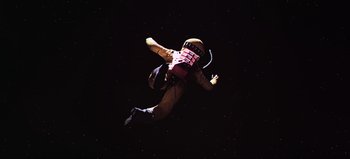 Movie still from “2001: A Space Odyssey” (1968), directed by Stanley Kubrick – A person in a spacesuit jumping in the air; Wide shot, Overhead angle