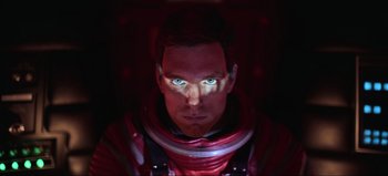Movie still from “2001: A Space Odyssey” (1968), directed by Stanley Kubrick – A person wearing a red suit; Close Up shot, Low angle