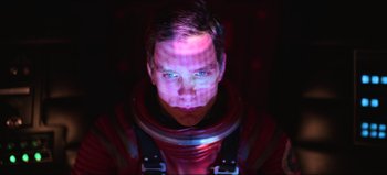 Movie still from “2001: A Space Odyssey” (1968), directed by Stanley Kubrick – A man in a space suit is looking into the camera; Close Up shot, Overhead angle