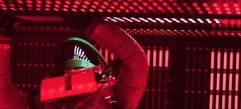 Movie still from “2001: A Space Odyssey” (1968), directed by Stanley Kubrick – A person in a space suit in a red room; Medium shot, Low angle