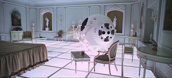 Movie still from “2001: A Space Odyssey” (1968), directed by Stanley Kubrick – A room with a table and chairs in it; Wide shot, High angle