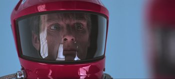 Movie still from “2001: A Space Odyssey” (1968), directed by Stanley Kubrick – A man wearing a helmet with a cigarette in his mouth; Close Up shot, Low angle