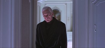 Movie still from “2001: A Space Odyssey” (1968), directed by Stanley Kubrick – An older man with white hair wearing a black robe; Medium shot, Low angle