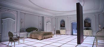 Movie still from “2001: A Space Odyssey” (1968), directed by Stanley Kubrick – A bedroom with a bed , dresser , and chair in it; Extreme Wide shot, High angle