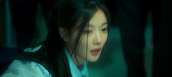 Movie still from “20th Century Girl” (2022), directed by Woo-ri Bang – A woman with long black hair looking out of a car window; Close Up shot, Over the shoulder angle