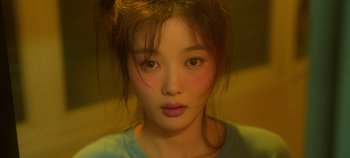 Movie still from “20th Century Girl” (2022), directed by Woo-ri Bang – A young woman's face; Close Up shot, High angle