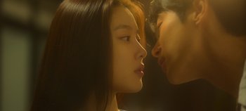 Movie still from “20th Century Girl” (2022), directed by Woo-ri Bang – A young woman and a young man face to face; Extreme Close Up shot, Over the shoulder angle
