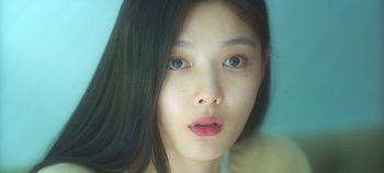 Movie still from “20th Century Girl” (2022), directed by Woo-ri Bang – A person with long black hair; Extreme Close Up shot, Low angle