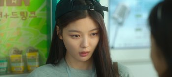 Movie still from “20th Century Girl” (2022), directed by Woo-ri Bang – A person wearing a hat; Close Up shot, Over the shoulder angle