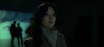 Movie still from “20th Century Girl” (2022), directed by Woo-ri Bang – A woman in a white sweater and a coat; Close Up shot, Over the shoulder angle