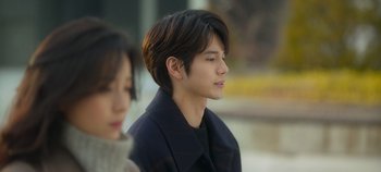 Movie still from “20th Century Girl” (2022), directed by Woo-ri Bang – A young man and a young woman are standing together; Close Up shot, Over the shoulder angle