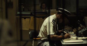 Movie still from “The Double” (2013), directed by Richard Ayoade – Medium shot, Over the shoulder angle