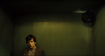 Movie still from “The Double” (2013), directed by Richard Ayoade – Medium shot, Low angle