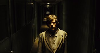 Movie still from “The Double” (2013), directed by Richard Ayoade – Medium shot, Over the shoulder angle
