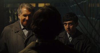 Movie still from “The Double” (2013), directed by Richard Ayoade – Medium shot, Over the shoulder angle